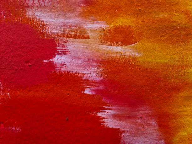 istock Red and orange paint strokes creating abstract design on wall 2198551981