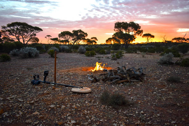 istock Sunset in Australian desert with campfire and tools 2198561740