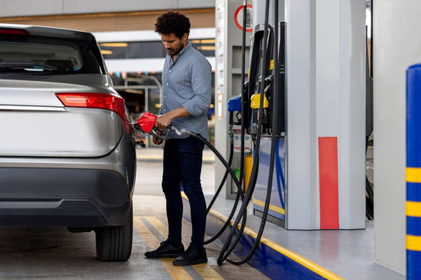 istock Man refueling his car at a gas station 2198562603