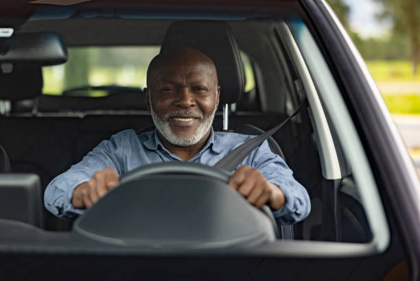 istock Happy man driving a car and smiling 2198562618