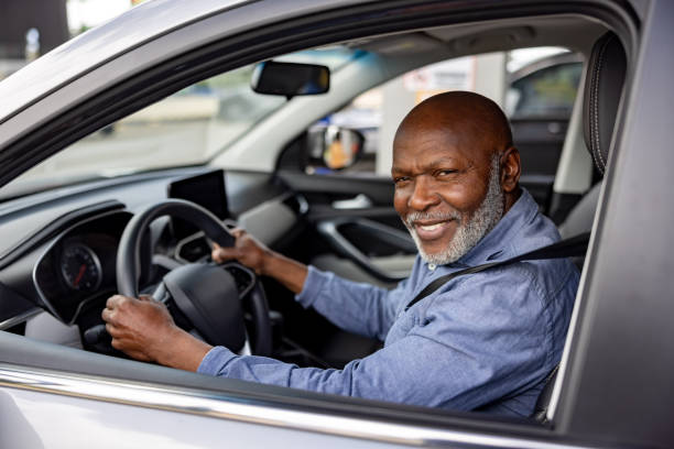istock Crowdsourced taxi driver smiling in his car 2198565851