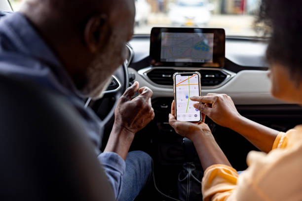 Senior couple using their GPS app to plan their car ride