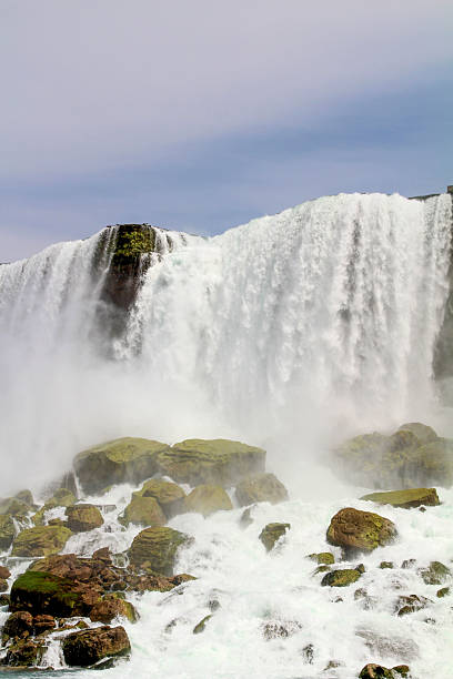 istock Majestic waterfall cascading over rocky cliffs in natural landscape 2198566894