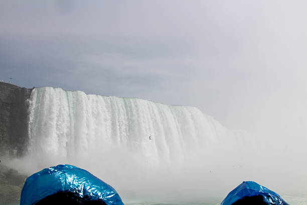istock Visitors enjoy the mist at Niagara Falls on a sunny day 2198566916