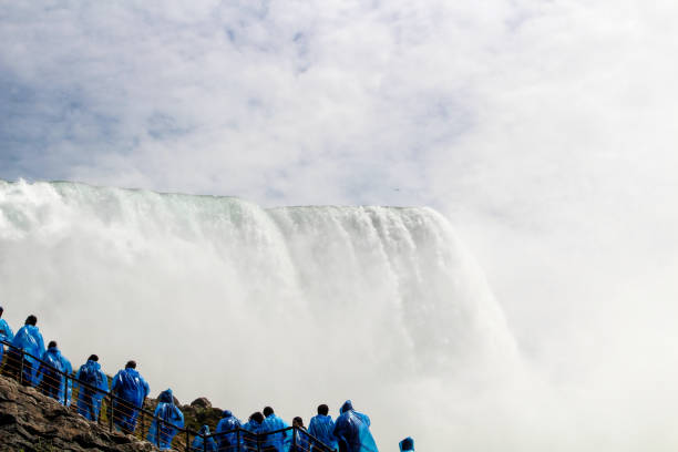 istock Visitors in blue ponchos at Niagara Falls during daytime 2198566928
