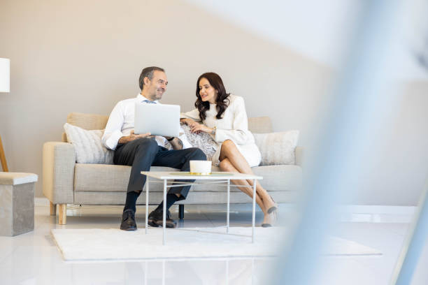 istock Stylish Couple in Cozy Business Setting 2198567063