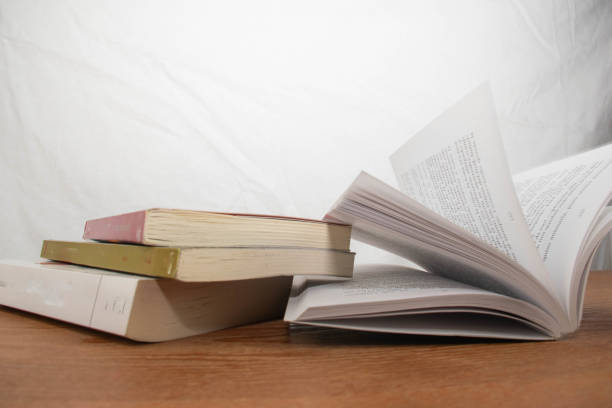 istock Stack of Books on a Wooden Table 2198568035