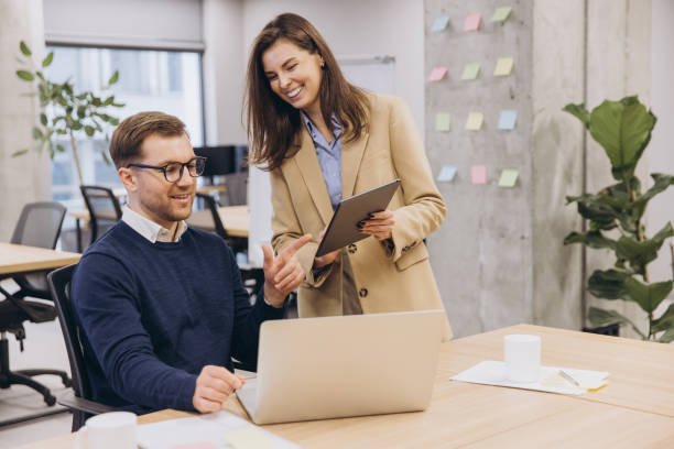 istock Business colleagues working together, analyzing data on laptop and tablet in modern workspace 2198570761