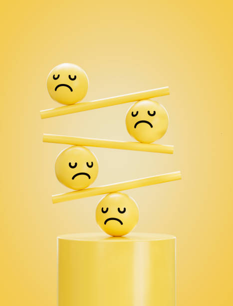 istock Sad Face Emojis on a Balancing Board, Emotional Stability Concept 2198571169