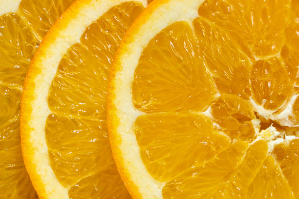 Juicy orange background made from sliced orange.