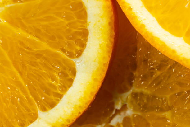 istock Juicy orange background made from sliced orange 2198571324