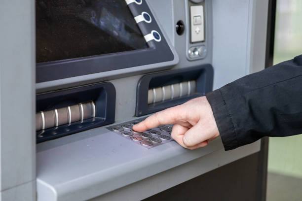 istock close-up of a person entering a pin code on an atm keypad, highlighting modern banking technology and financial transactions 2198576247