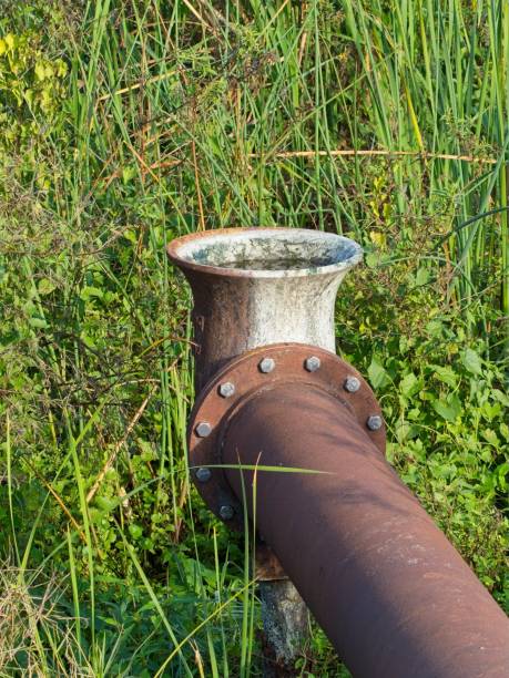 istock Discharge pipe feeding into retainment pond at Viera wetlands 2198576962