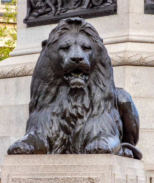 A statue of Florence Nightingale (1820-1910) with the Guards Crimean War Memorial in Waterloo Place, St James’s, Central London. The smaller statue is of Sidney Herbert, 1st Baron Herbert of Lea (1810-1861), a vital supporter of Florence Nightingale in her efforts to introduce efficient and hygienic nursing practices to Scutari Hospital in Crimea during the Crimean War (1853-56). The Guards memorial is Grade II listed and the artist was John Bell.