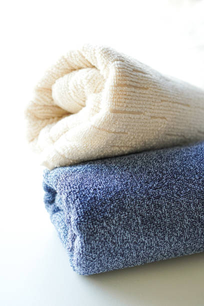 istock A stack of fluffy towels on white background 2198579001