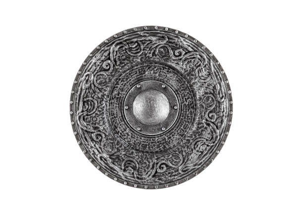Old decorated metal round shield isolated on white background