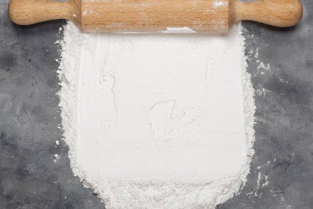 istock wooden rolling pin and flour top view advertising space 2198582723