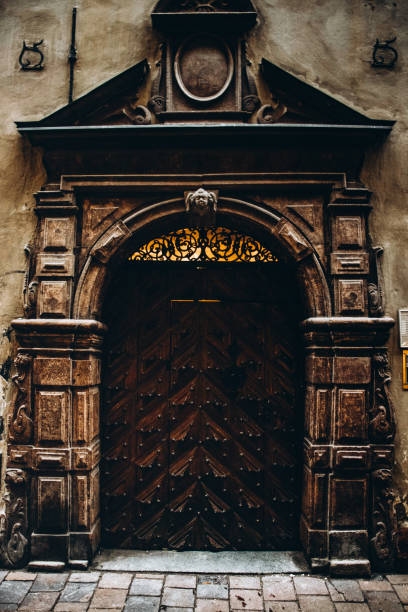 An old wooden gate with stone details in Stockholm's old town.