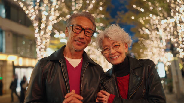 istock Senior Couple Portrait Under Festive Lights 2198586460
