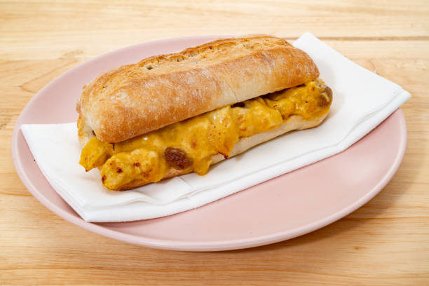 Curried Coronation Chicken bread sandwich on a plate