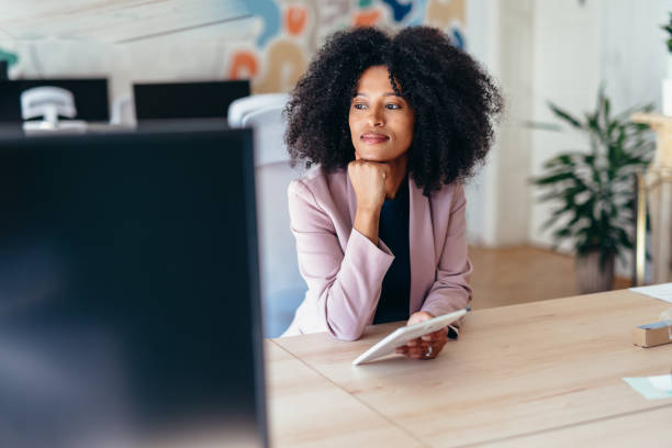 istock Businesswoman working with digital tablet and computer in modern office 2198589645