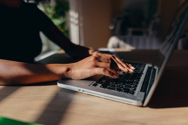 istock Woman typing on laptop keyboard working from home office 2198589720