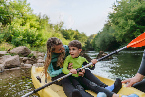 istock Mother and son kayaking on the river 2198590598