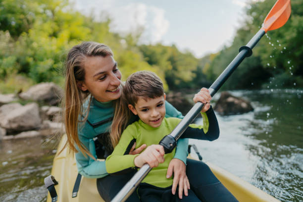 istock Mother and son kayaking on the river 2198590643