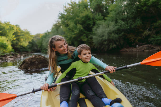 istock Mother and son kayaking on the river 2198590707