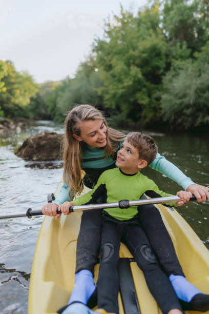 istock Mother and son kayaking on the river 2198590722
