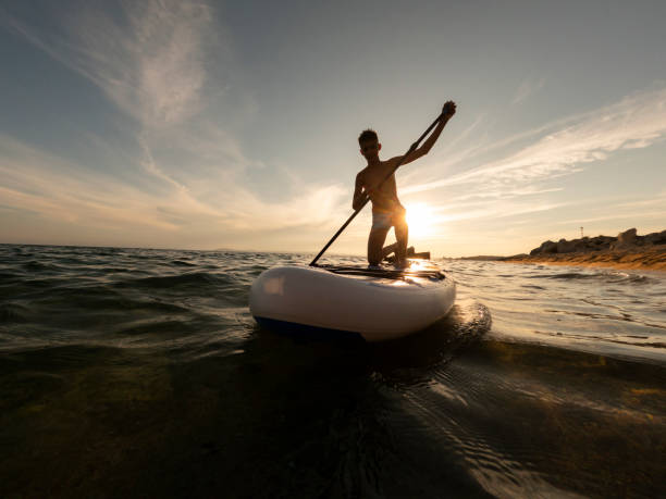 istock Teen boy on paddle board 2198591008