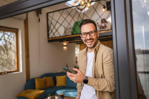 istock One adult man at home use smart phone app browse internet or send sms 2198593241