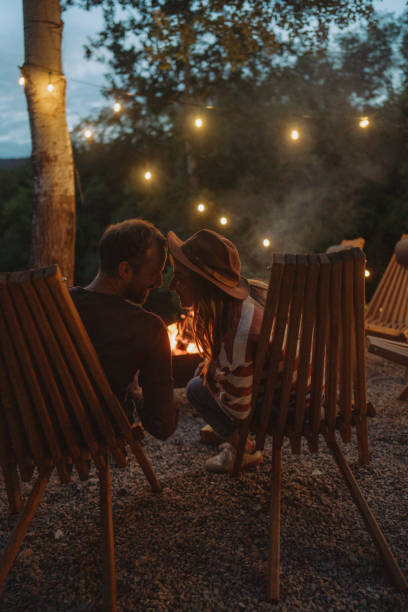 istock Romantic couple by the campfire 2198593968