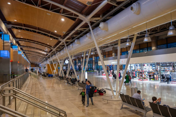 Madrid, Spain - January 5, 2024. Passengers at terminal of Madrid International Airport (Adolfo Suarez Madrid-Barajas Airport), Madrid, Spain