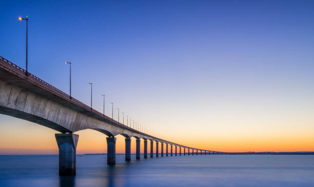istock Sunset view of Ile-de-Re bridge stretching over calm waters 2198598889
