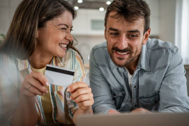 istock Young couple browsing and buying online 2198600540