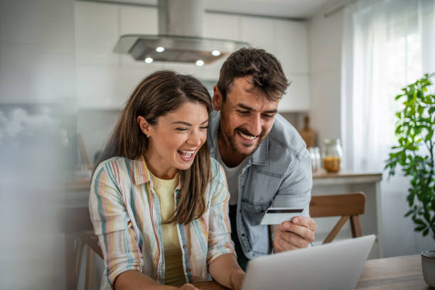 istock Young couple browsing and buying online 2198600545