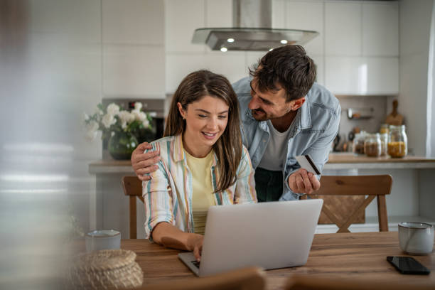istock Young couple browsing and buying online 2198600551