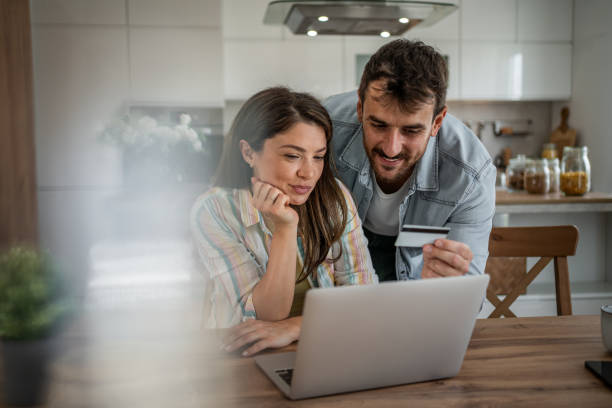 istock Young couple browsing and buying online 2198600552