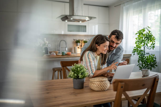 istock Young couple browsing and buying online 2198600560