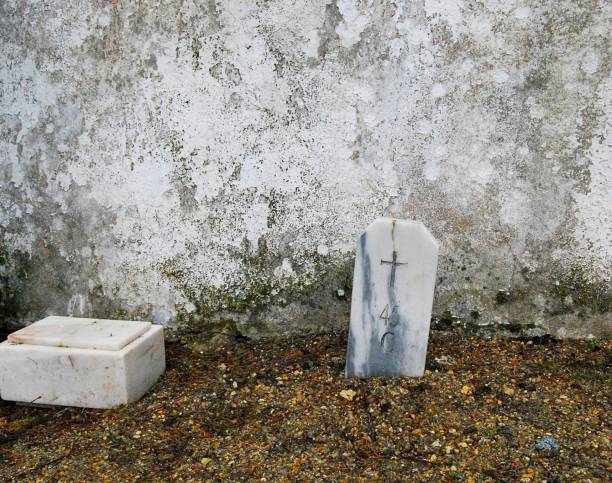 Headstones of notable graves in the village cemetery, decorated for All Souls' Day.