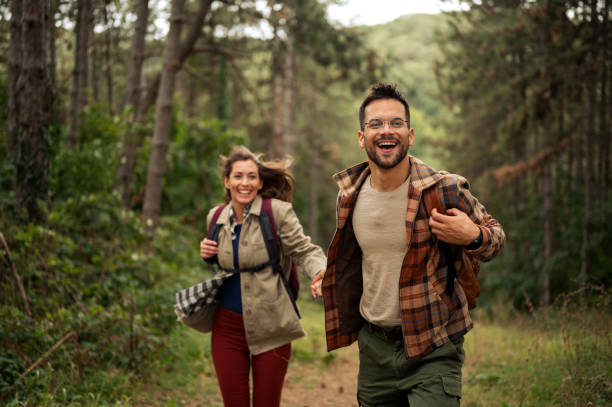 istock Beautiful young couple exploring nature 2198601550