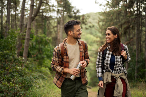 istock Beautiful young couple exploring nature 2198601564
