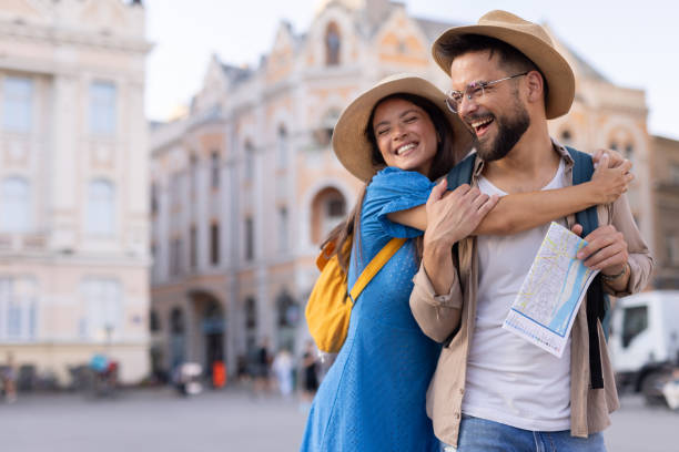 istock Cheerful couple sharing a happy moment in urban setting 2198601957