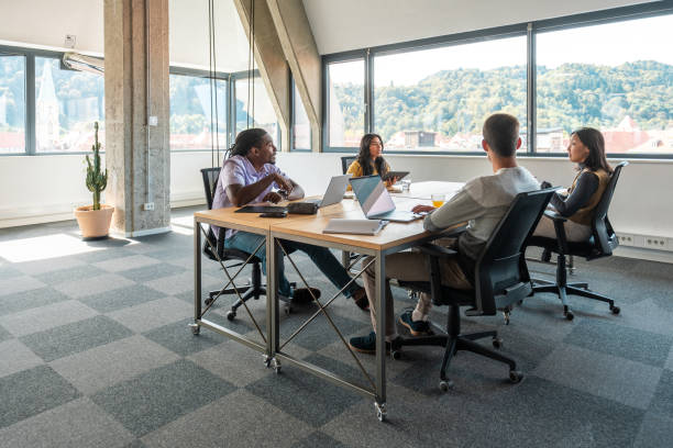 istock Diverse Team of Entrepreneurs Working in a Bright Coworking Space 2198601979