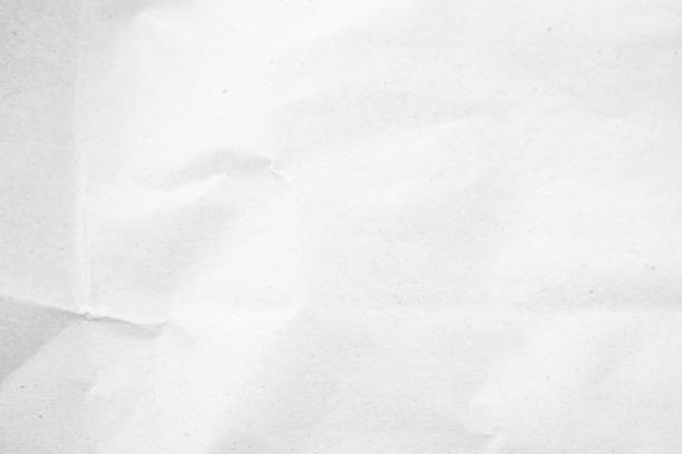 istock White recycled craft paper texture as background. Grey paper texture, Old vintage page or grunge vignette of old newspaper. Pattern rough art creased grunge letter. Hardboard with copy space for text. 2198602018