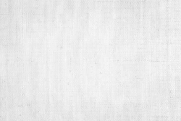 istock White color fabric canvas woven texture background in pattern light blank. Natural gauze linen, carpet wool and cotton cloth textile textured as clean empty for decoration text. Grey sack material. 2198602028