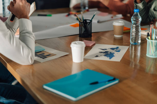 istock Businesspeople planning global strategy in office meeting 2198602267