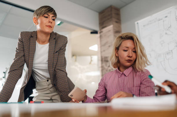 istock Businesswomen working together on project in modern office 2198602287