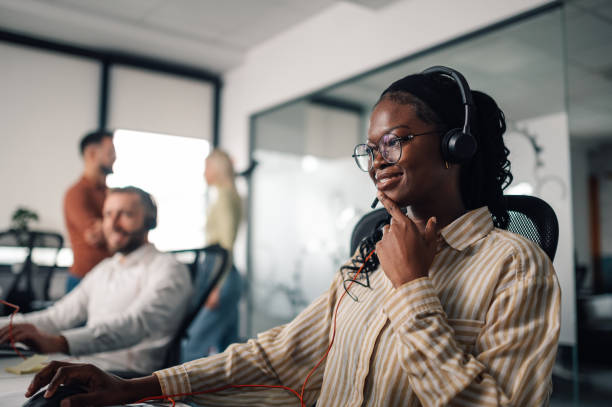 istock Customer service representative working in busy call center office 2198602332